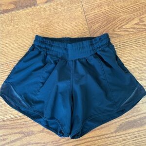 Lululemon Navy Hotty Hot Size 2T. Lined. 4” inseam. Like new. Pfsf home.